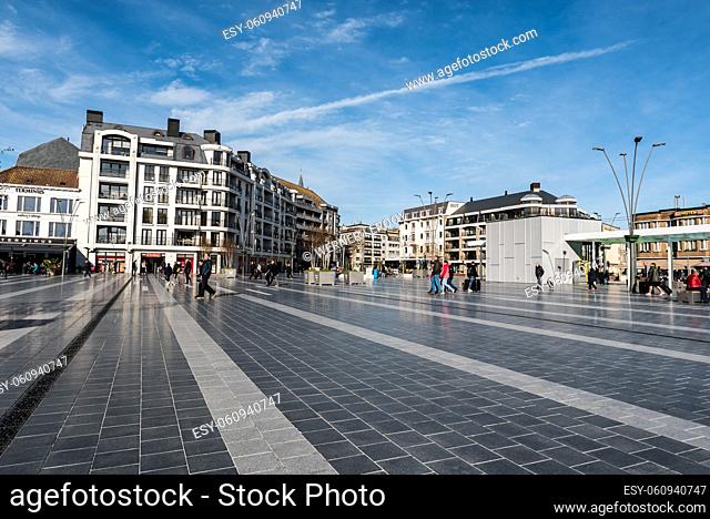 Blankenberge, Flanders - Belgium: People walking at the Leopold III square near the railwaystation
