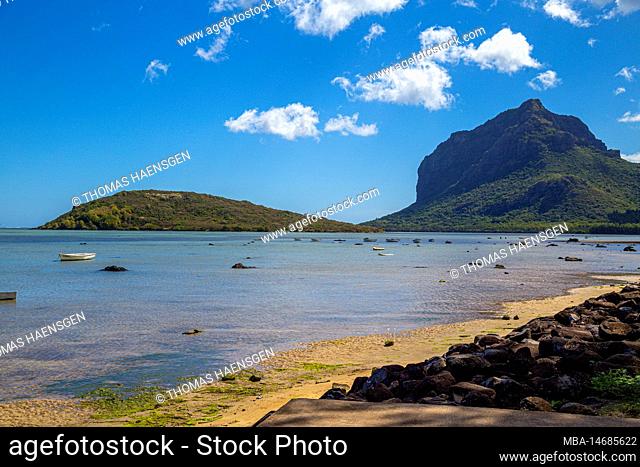 A Beach and the ocean in front of le Morne Brabant Mountain at Mauritius Island, Africa
