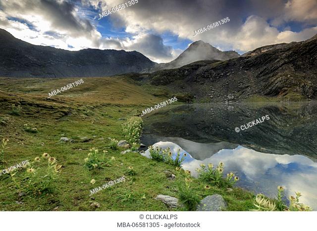 The high peaks and clouds are reflected in Fenetre Lakes Ferret Valley Saint Rhémy Grand St Bernard Aosta Valley Italy Europe