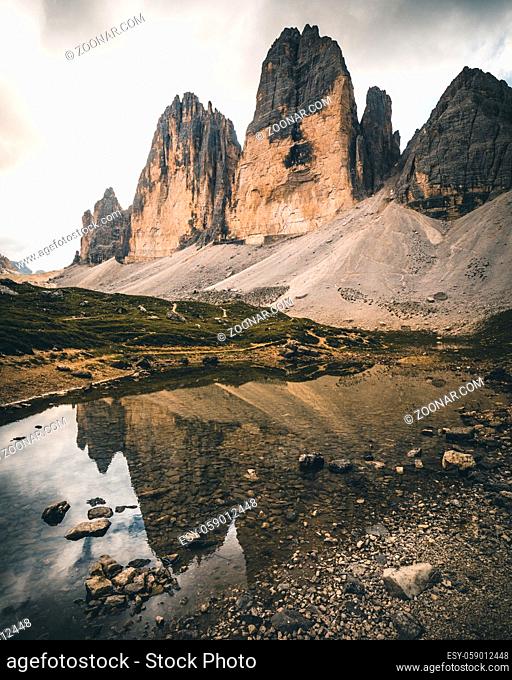 Tre cime di Lavaredo reflected from a lake, Dolomite Alps, Italy in summer