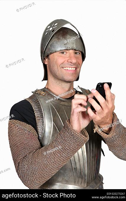 Knight of the Middle Ages with telephone