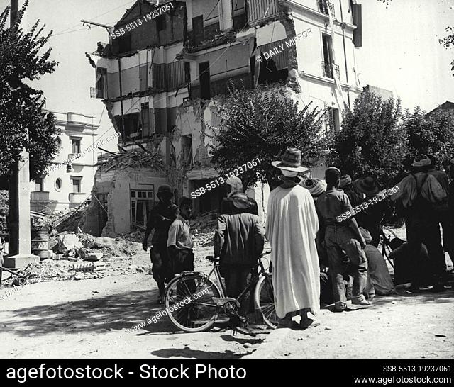 1, 100 Feared Dead in Algerian Earthquakes - Inhabitants of Orleansville look at the ruins of the Hotel Baudouin, Orleansville