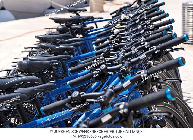 In Trogir blue bicycles are waiting for tourists. (08 July 2017) | usage worldwide. - Trogir/Croatia