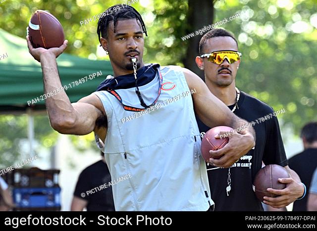 25 June 2023, North Rhine-Westphalia, Cologne: American Football: St. Brown Youth Football Camp. Equanimeous St. Brown (l) of the Chicago Bears and Osiris St