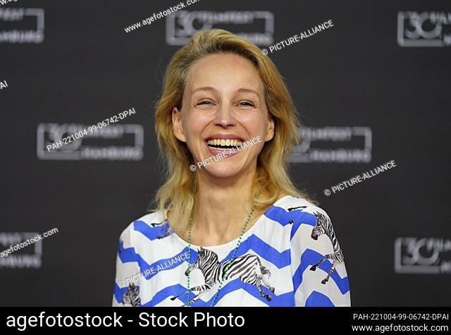 04 October 2022, Hamburg: Actress Petra Schmidt-Schaller stands on the red carpet at the 30th Filmfest Hamburg at the Cinemaxx cinema during the photocall of...