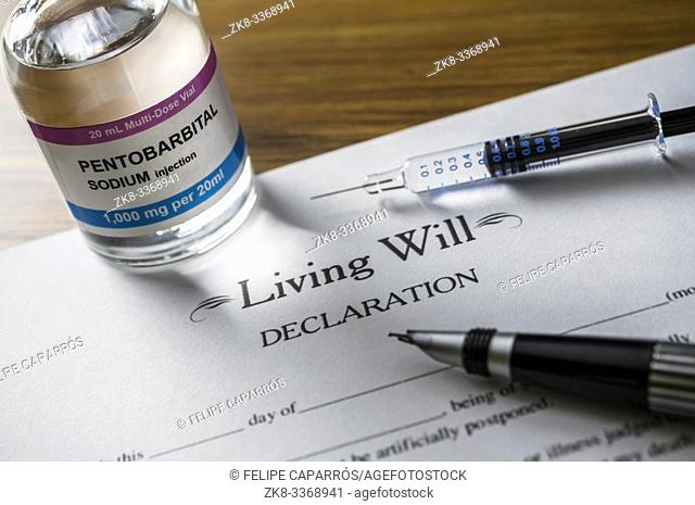 Living will declaration form Next to a vial of pentobarbital sodium to proceed to euthanasia, conceptual image