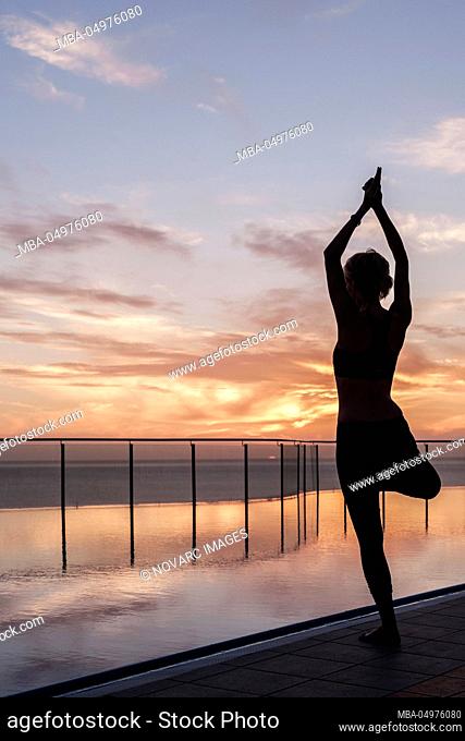Woman practices yoga, Amadores, Gran Canaria, Spain