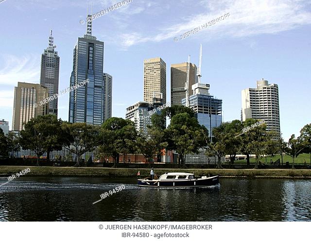 Water taxi at the southbank promenade on the Yarra River with the city skyline in the background, Melbourne, Victoria, Australia