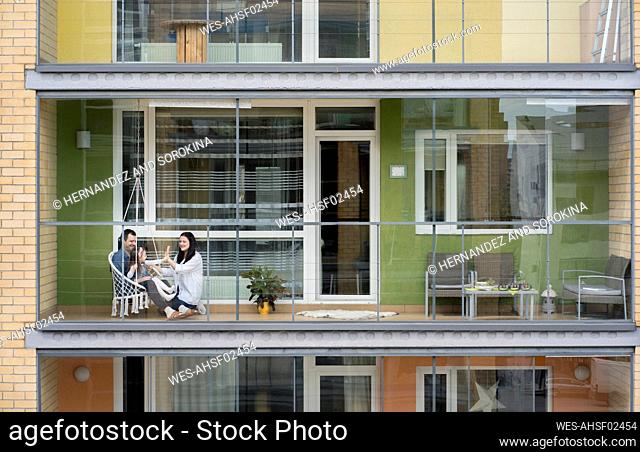 Family spending time together on balcony