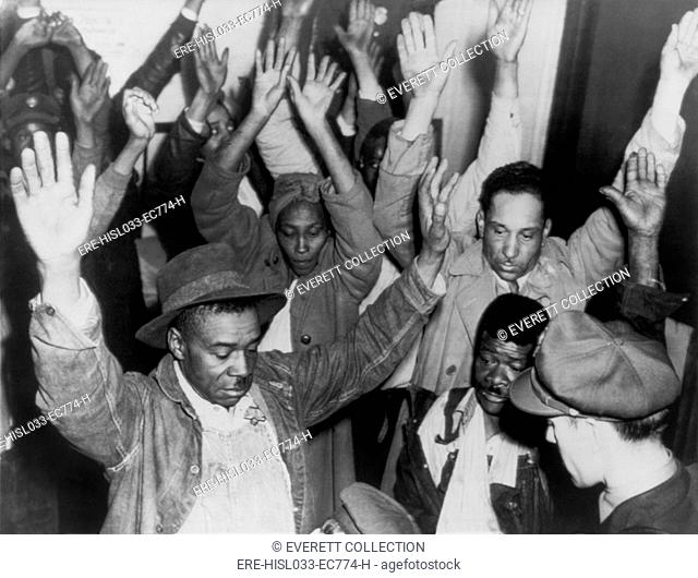 State highway patrolmen search group of Negroes arrested during rioting on Feb. 26, 1946. The Columbia, Tennessee riot began with a minor business dispute...