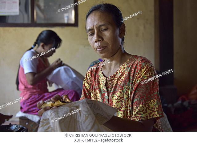 women using a pen-like tool, called ''canting'', to apply liquid hot wax in the batik-making process, Wirakuto batik workshop, Pekalongan, Java island