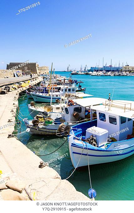 Moored fishing boats in the old Venetian Harbour of Heraklion, Crete, Greece
