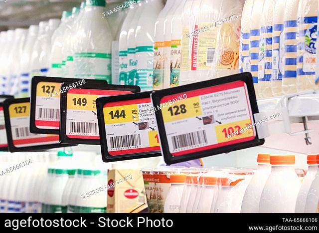 RUSSIA, SIMFEROPOL - DECEMBER 12, 2023: Dairy products with price tags on display in the 7M Beztsen superstore during the Christmas season