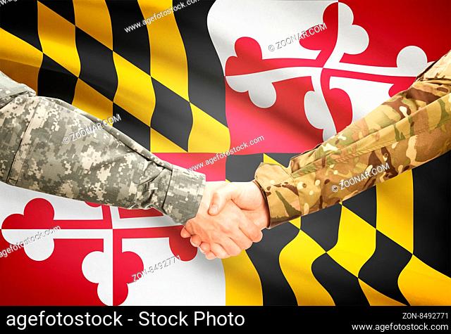 Soldiers handshake and US state flag - Maryland