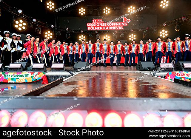 11 November 2023, North Rhine-Westphalia, Cologne: Carnivalists of the StattGarde Colonia Ahoy on stage on 11.11.2023 in Cologne at the opening of the 2023 2024...