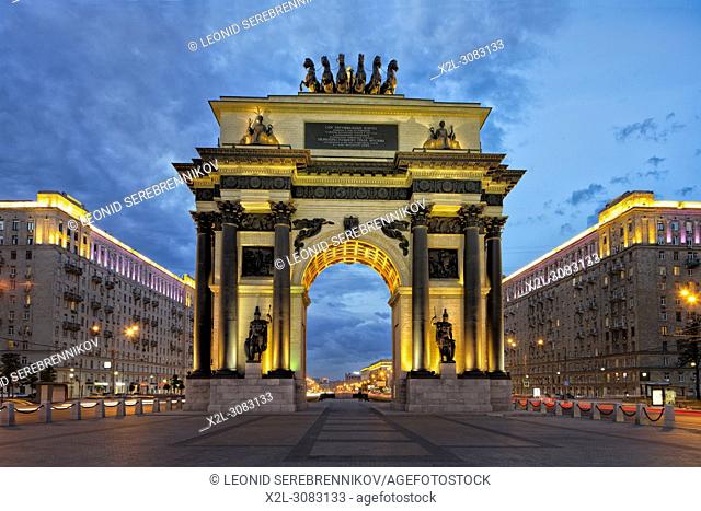 Triumphal Arch, built to commemorate Russia's victory over Napoleon, illuminated at dusk. Kutuzovsky Avenue, Moscow, Russia
