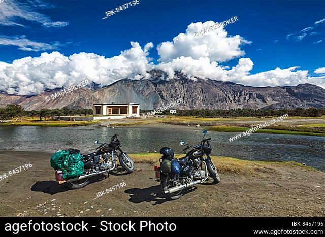 Moto tourism in India, two tourist bikes motorcycles in Nubra valley in Himalayas. Ladakh, India, Asia
