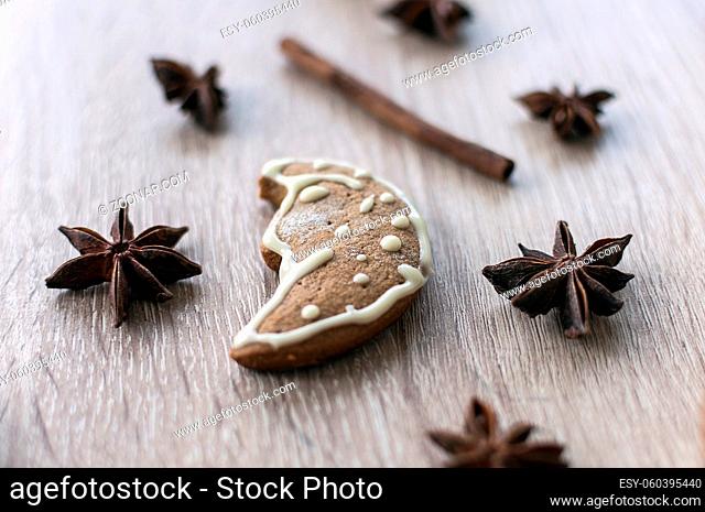 Christmas homemade gingerbread cookies on a wooden table. Moon shape