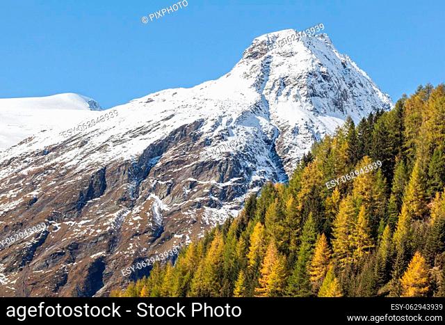 Snow-covered mountain peak in autumn