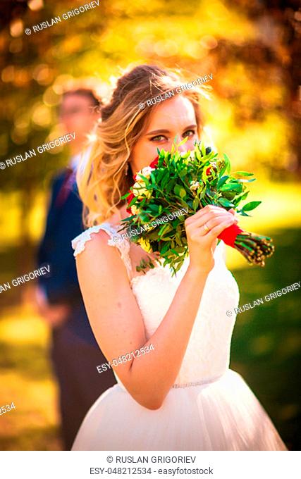 bride and groom on background summer forest