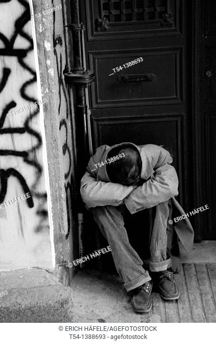 Poor beggar sleeping on the Entrace of a Door in Istanbul