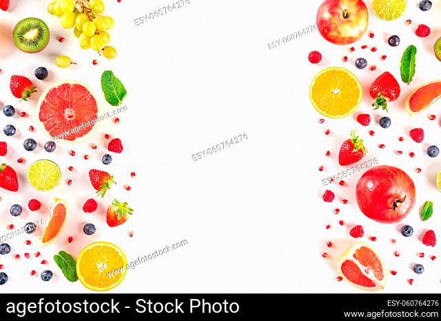Fresh fruit design template, a flat lay on a white background with copy space, vibrant food pattern, shot from above