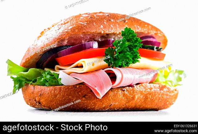Sandwich with cheese and ham and fresh vegetables isolated on white