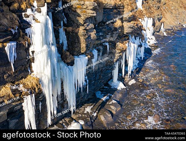 RUSSIA, VLADIVOSTOK - DECEMBER 4, 2023: A view of a rock covered with icicles in Bogdanovicha Bay of Russky Island. Yuri Smityuk/TASS