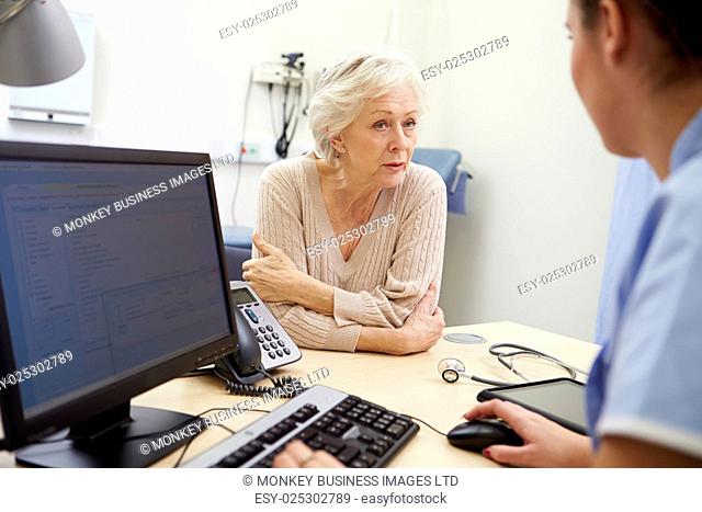 Senior Female Patient Has Appointment With Nurse