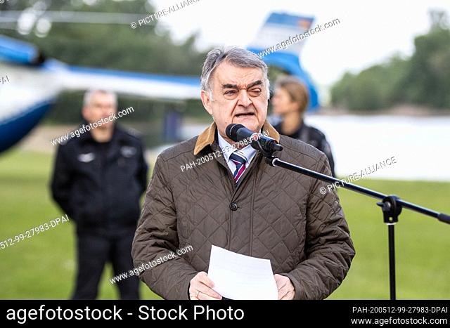 12 May 2020, North Rhine-Westphalia, Duesseldorf: Herbert Reul (CDU), Interior Minister of North Rhine-Westphalia, speaks in front of a helicopter