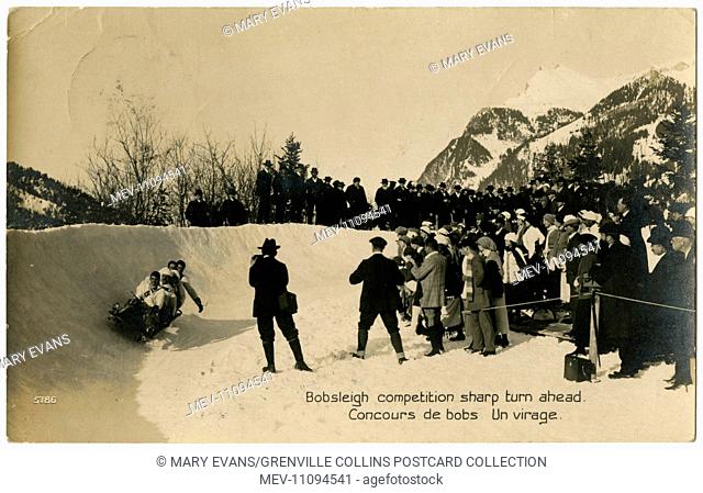 Spectators watch a Bobsleigh team negotiate a sharp turn the run at Morgins, Switzerland, part of the Portes du Soleil ski resort