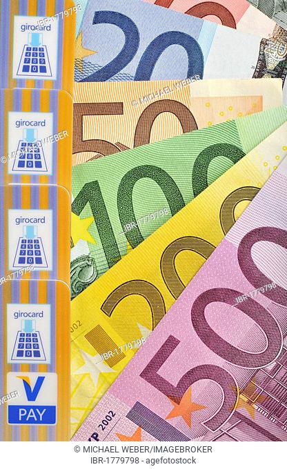 Euro banknotes, bills fanned out, bank card, cash card with the latest icons, V-PAY, VPAY, girocard