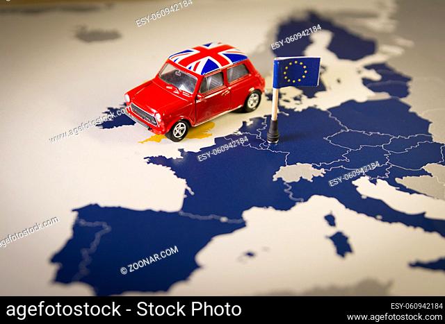 Red vintage car with Union Jack flag over an UE map and flag. Symbolizing the Brexit concept.The UK is thus on course to leave the EU on 29 March 2019