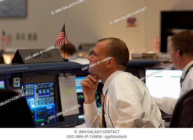 In the space shuttle flight control room of Johnson Space Center's Mission Control Center (MCC), astronaut Dominic A. (Tony) Antonelli monitors launch countdown...