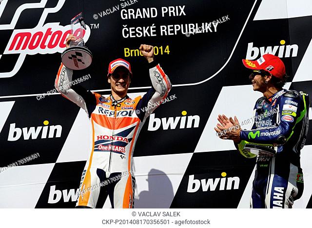 Third placed Valentino Rossi, of Italy, right, congratulates first placed Dani Pedrosa, of Spain, left, after the Czech Republic motorcycle Grand Prix MotoGP...