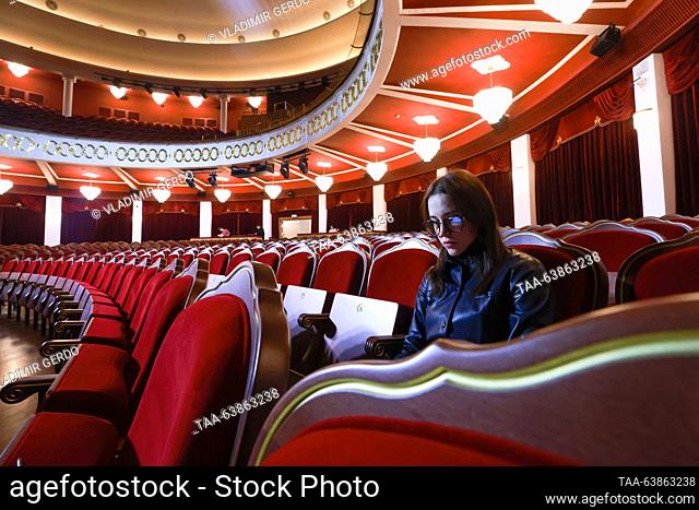 RUSSIA, MOSCOW - OCTOBER 25, 2023: A woman sits in the auditorium of the Moscow Variety Theatre on the day of its reopening after a three-year renovation