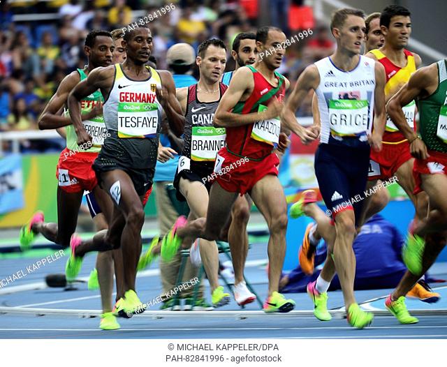 Homiyu Tesfaye (L) of Germany competes in the men's 1500m heats of the Athletic, Track and Field events during the Rio 2016 Olympic Games at the Olympic Stadium...