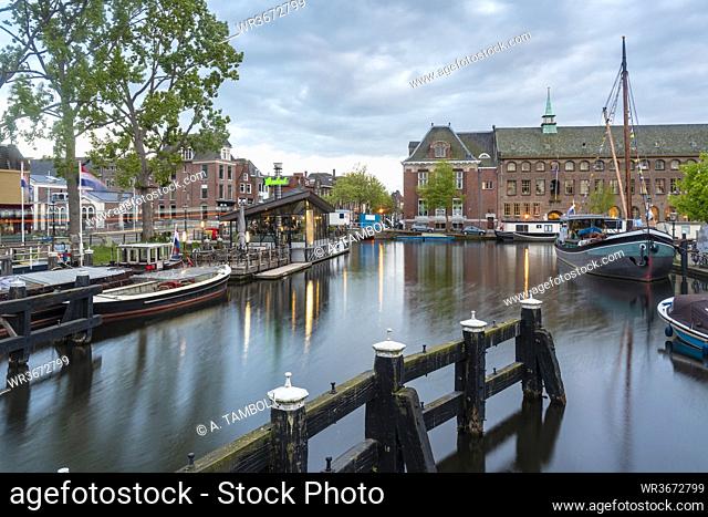 Netherlands, South Holland, Leiden, Boats moored in old harbor by Galgewater