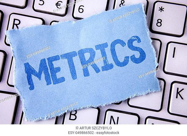 Word writing text Metrics. Business concept for Method of measuring something Study poetic meters Set of numbers written Tear Sticky note paper piece placed...