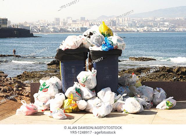 Overflowing rubbish bins  El Confital, Las Palmas, Canary Islands, Spain