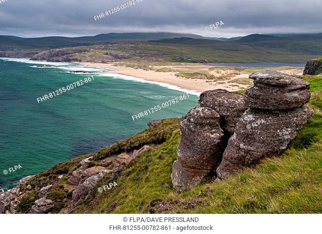 View of coastline with sandy beach, dunes and freshwater loch, Traigh Shanabhait, Sandwood Bay, Sutherland, Highlands, Scotland, August