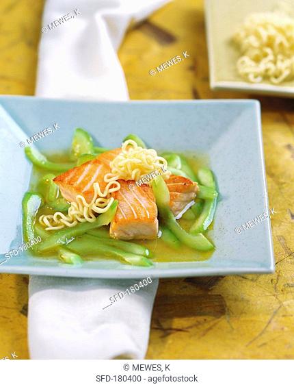 Salmon fillet with stock with cucumber