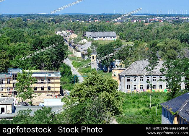 14 July 2020, Brandenburg, Potsdam: The former barracks area Krampnitz near the lake Fahrlander See. On the left side a scaffold is placed at former Russian...