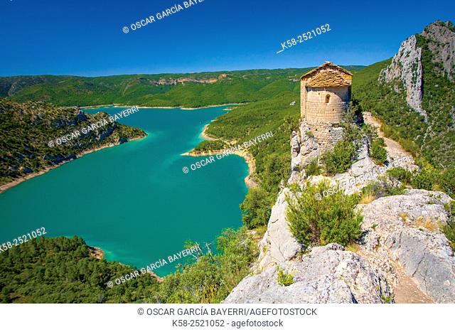 Romanesque hermitage of Mare de Deu de la Pertusa in the way of the gorge Mont-rebei with Canelles reservoir in the bottom of Lleida Montsec