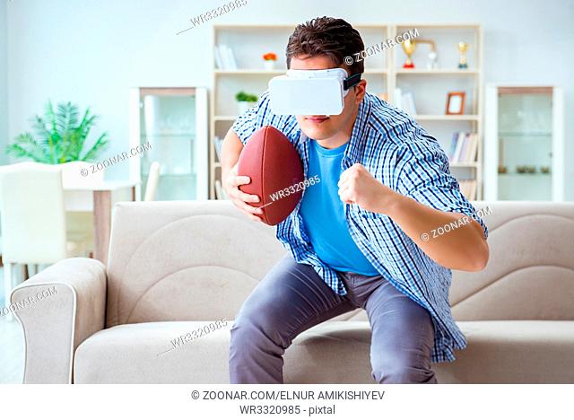 Man wearing virtual reality VR glasses watching american football