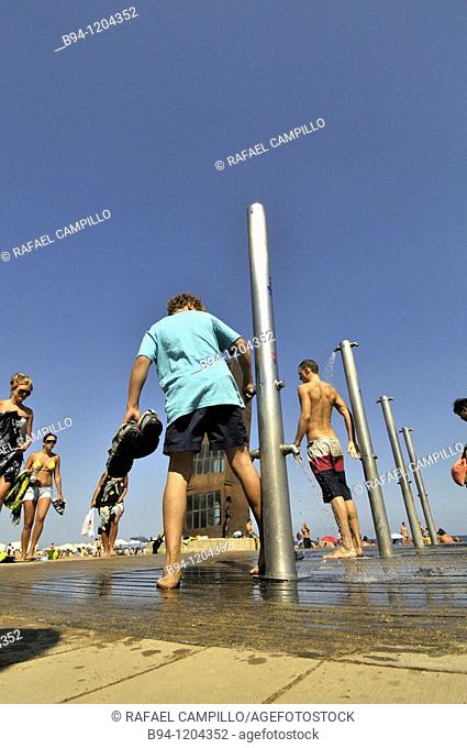 Showers and sculpture 'The wounded star'(L'estel ferit) by Rebecca Horn at Barceloneta beach, Barcelona, Catalonia, Spain