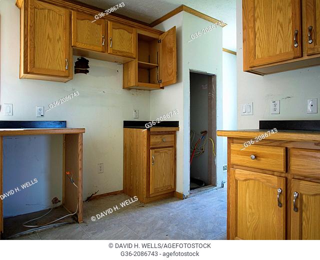 Interior of a room with wooden cabinets inside a foreclosed house in Portland, Maine, United States