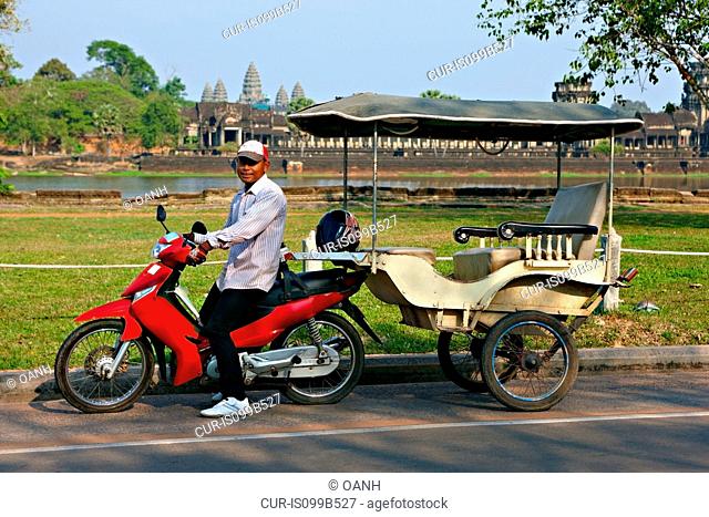 Tuk tuk driver at Angkor Wat, Siem Reap, Cambodia , Vietnam