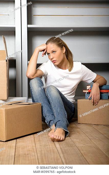 young woman and cartons, removal
