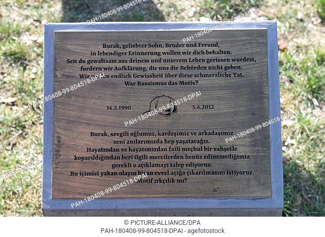 08 April 2018, Germany, Berlin: A plaque in front of the memorial for Burak.B. The young man was shot in a street in Neukoelln on 05 April 2012